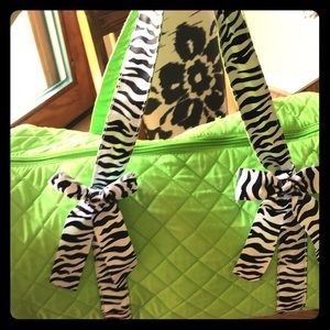 Lime green and zebra striped duffel bag